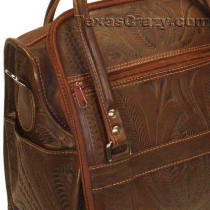 brown tooled leather luggage closeup f