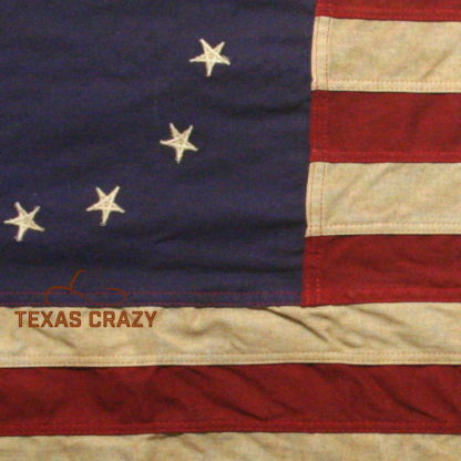 Vintage antiqued betsy ross flag closeup embroidered cotton